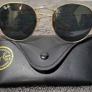Ray Ban round gold metal polarized sunglasses.